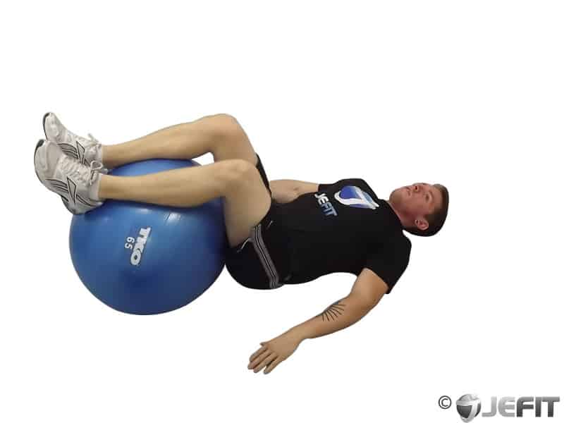 man doing the hook lying position with a stability ball